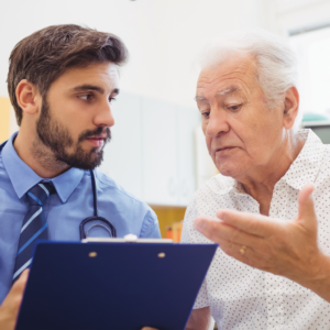 Older man speaking to doctor